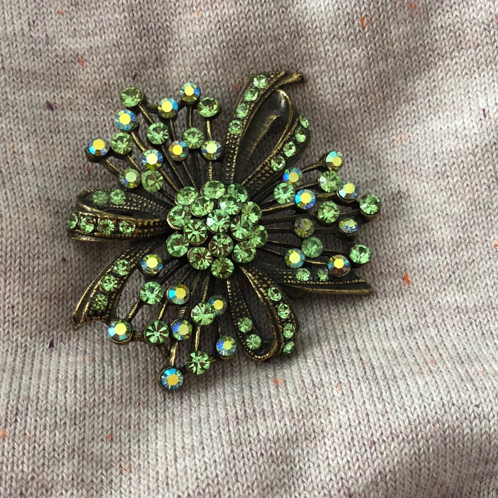 Fun and flashy green brooch .